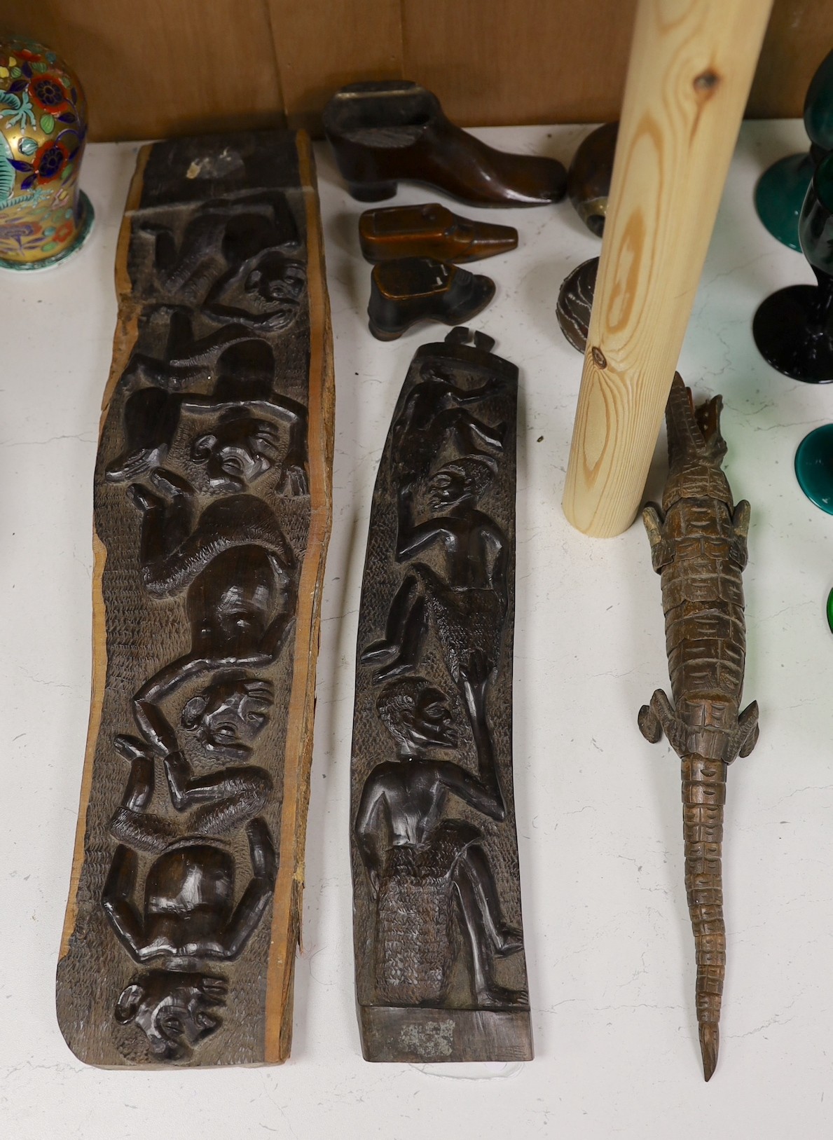 An interesting sectional wooden articulated crocodile, together with African wooden tribal carved totems, and other miscellaneous wooden items, tallest 53cm